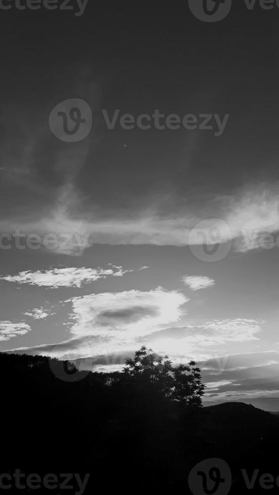 landscape vertical picture, white cloud vintage sky, daylight top view high tree, with mountain background around countryside. Thailand. photo