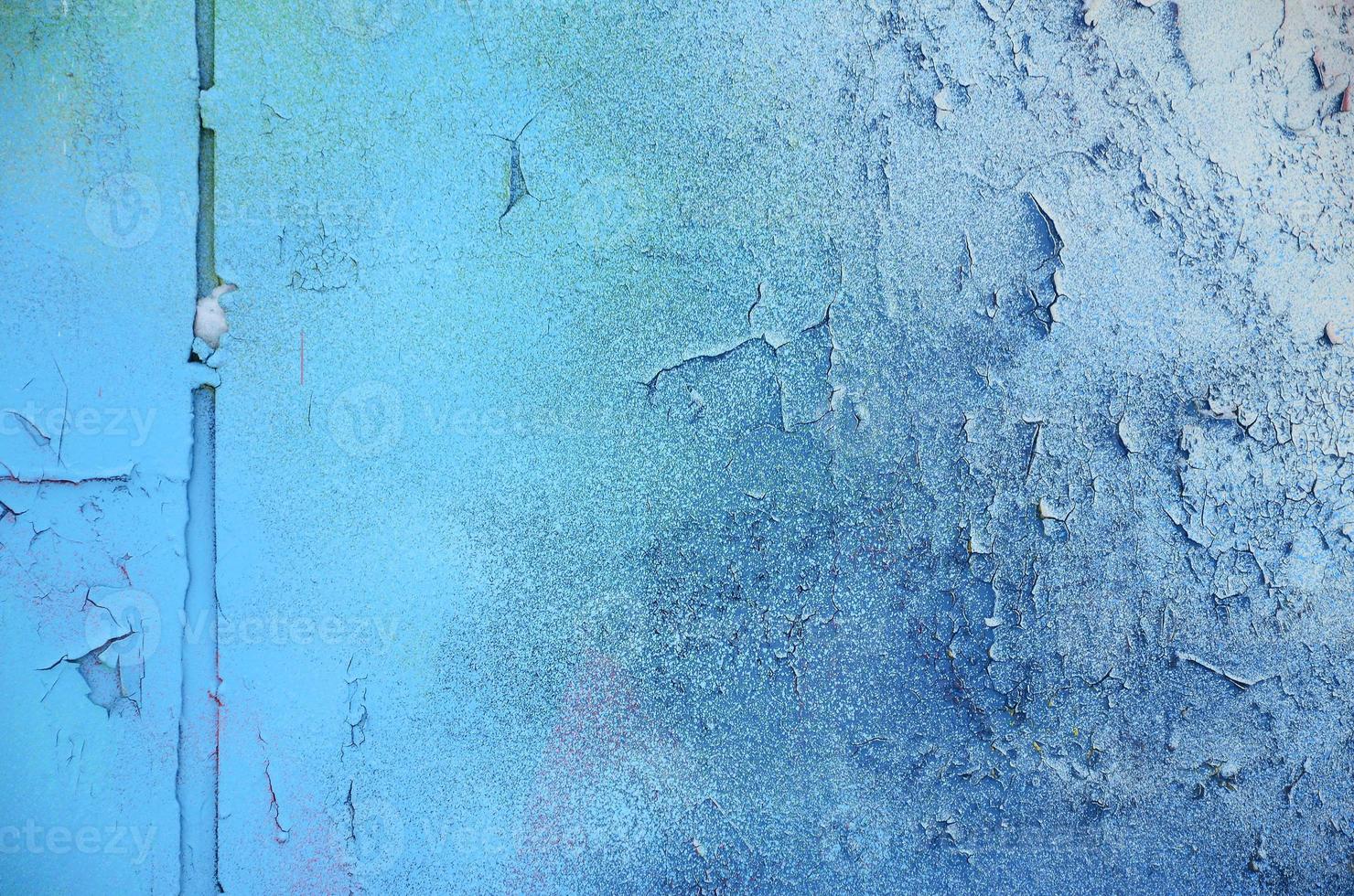 A large fragment of the graffiti pattern applied to the wall with aerosol paint. The gradient between several colors is carried out by spraying the paint. Abstract background image photo