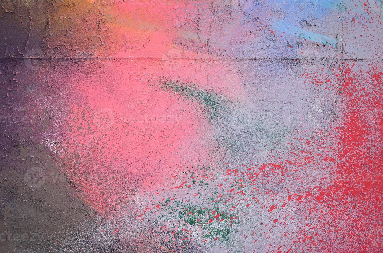 A large fragment of the graffiti pattern applied to the wall with aerosol paint. The gradient between several colors is carried out by spraying the paint. Abstract background image photo