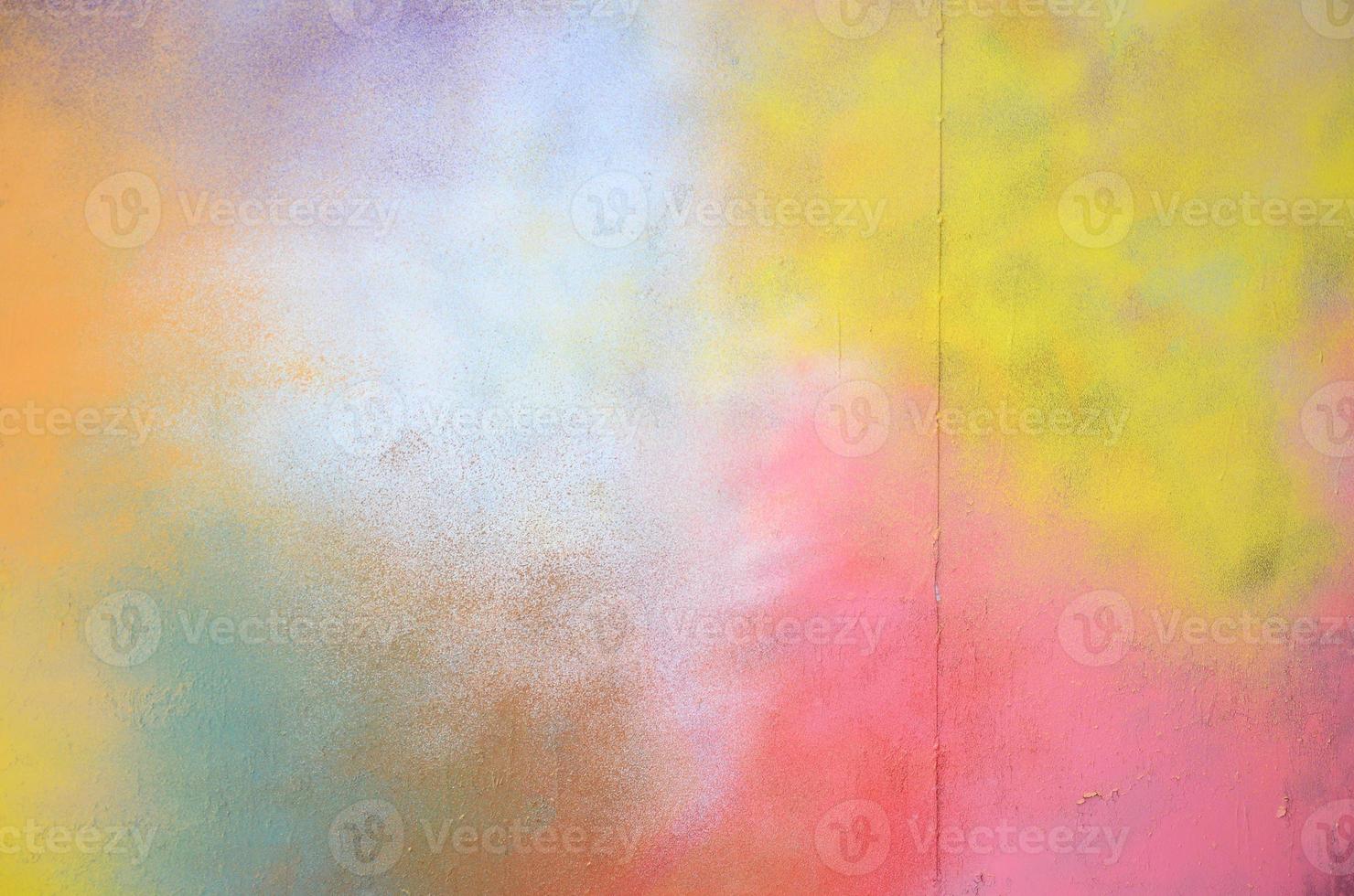 A large fragment of the graffiti pattern applied to the wall with aerosol paint. The gradient between several colors is carried out by spraying the paint. Abstract background image photo