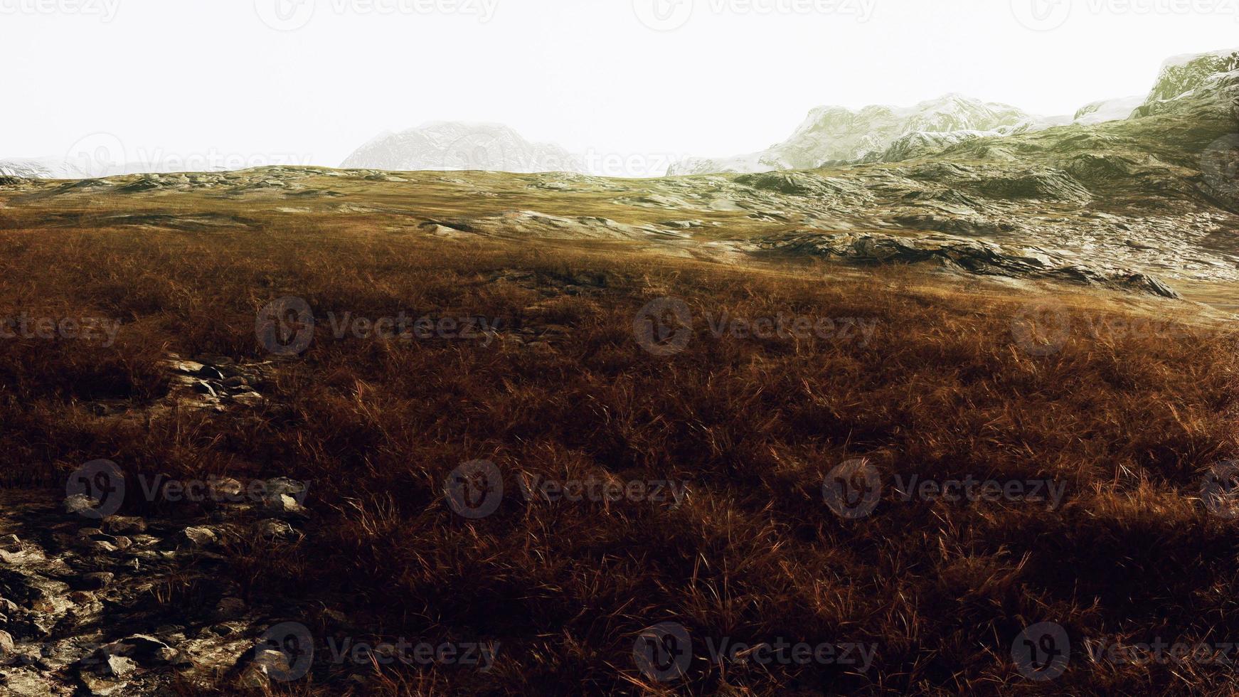 Beautiful Rocks in Province of Afghanistan with dry grass photo