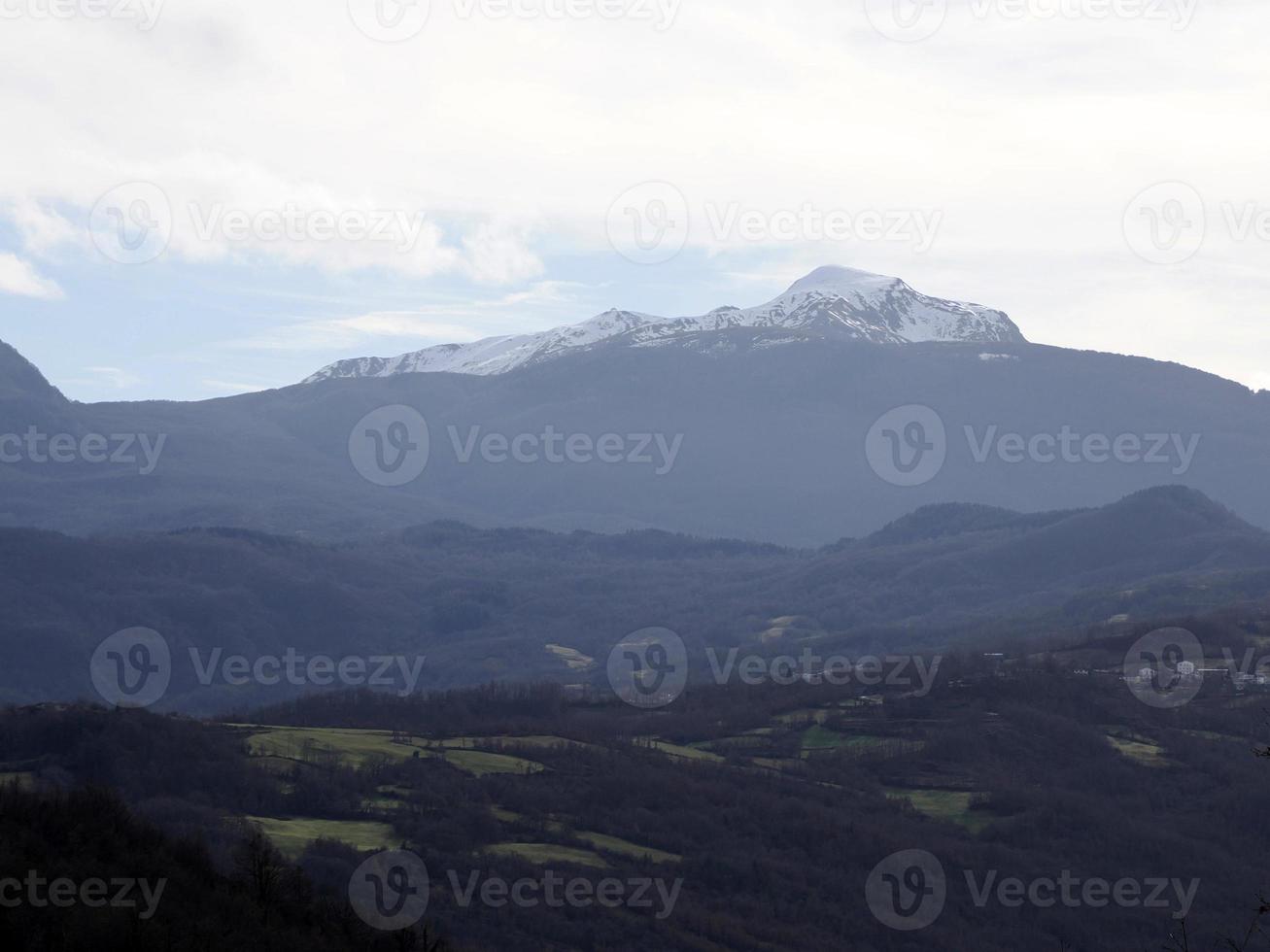 low clouds like fog in appennines valley around Bismantova stone a rock formation in the Tuscan-Emilian Apennines photo