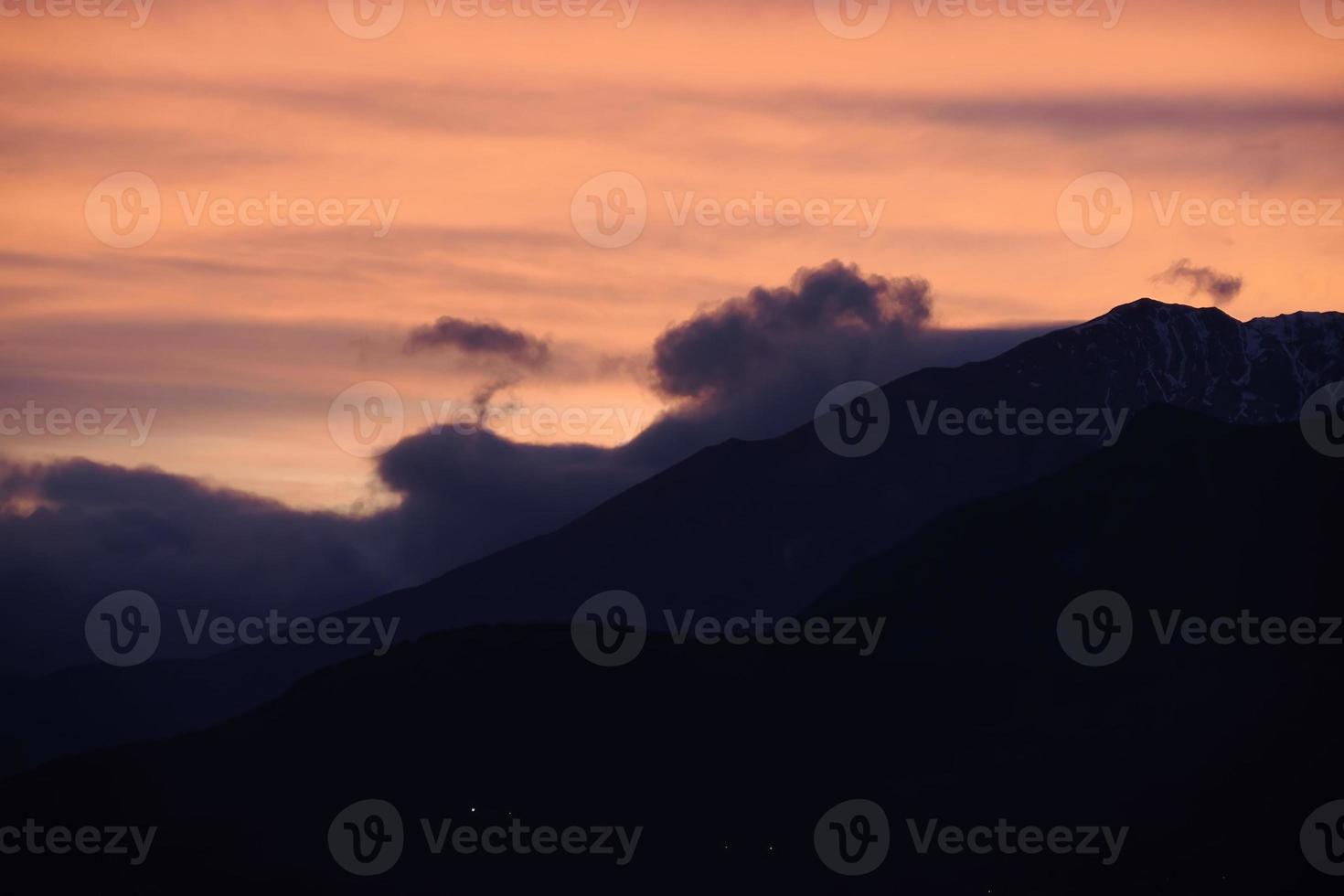 View of valley around Bismantova stone a rock formation in the Tuscan-Emilian Apennines at sunset photo