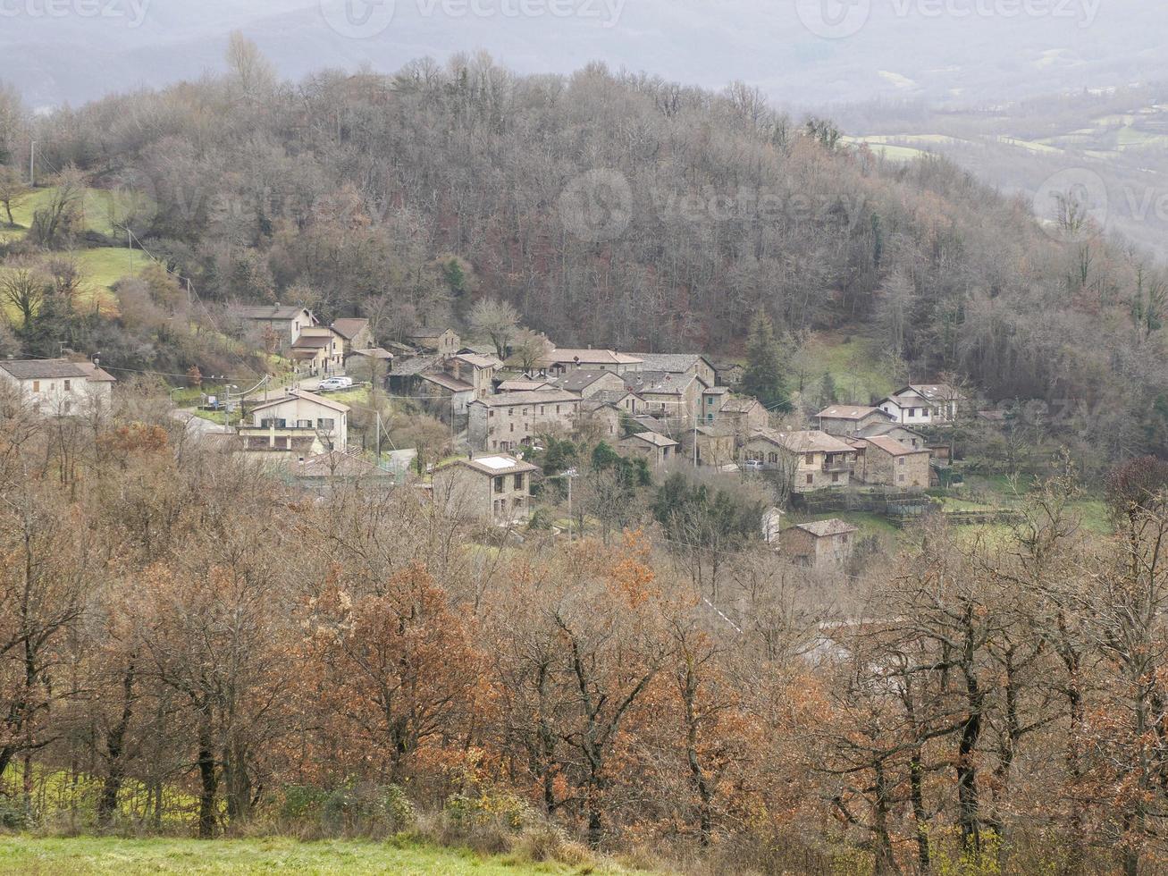 View of valley around Bismantova stone a rock formation in the Tuscan-Emilian Apennines at sunset photo