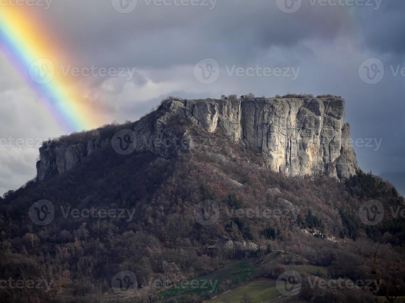 a rainbow over Bismantova stone a rock formation in the Tuscan-Emilian Apennines photo