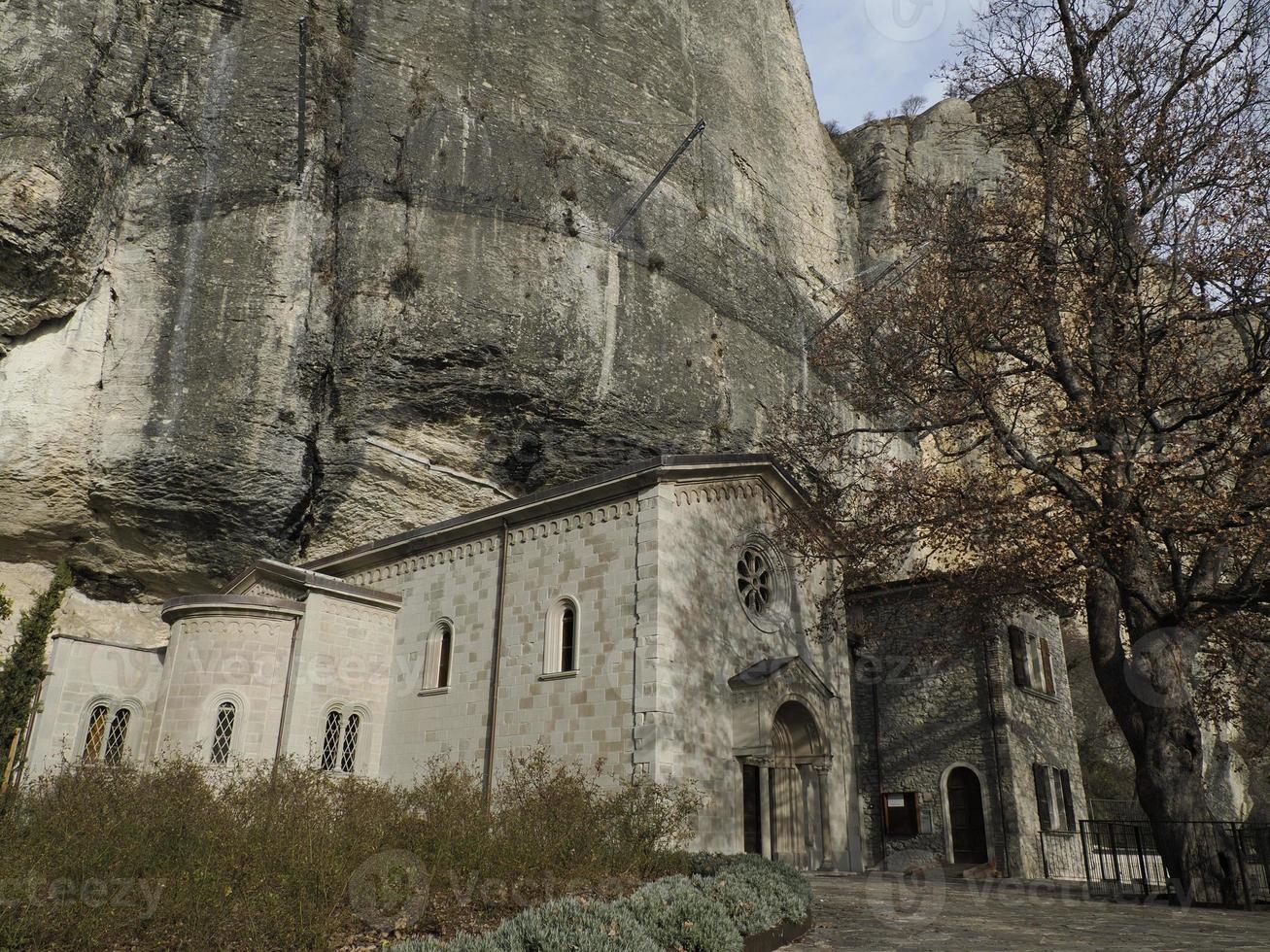 The Benedictine hermitage at the foot of the Bismantova Stone ormation in the Tuscan-Emilian Apennines photo