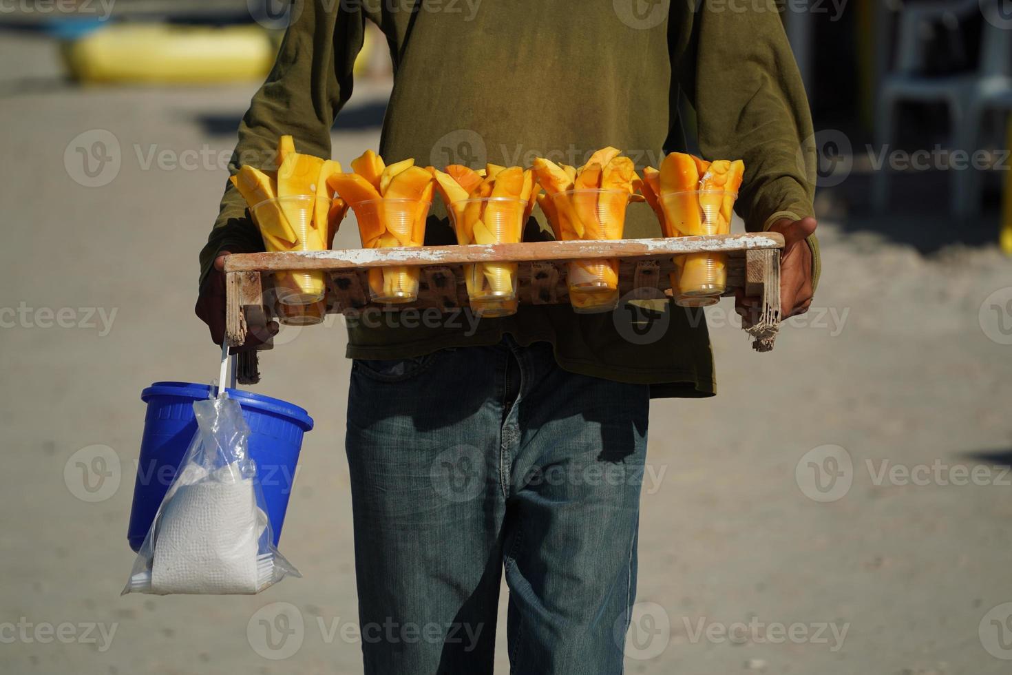 fruit for sale salesman on mexican sandy beach photo