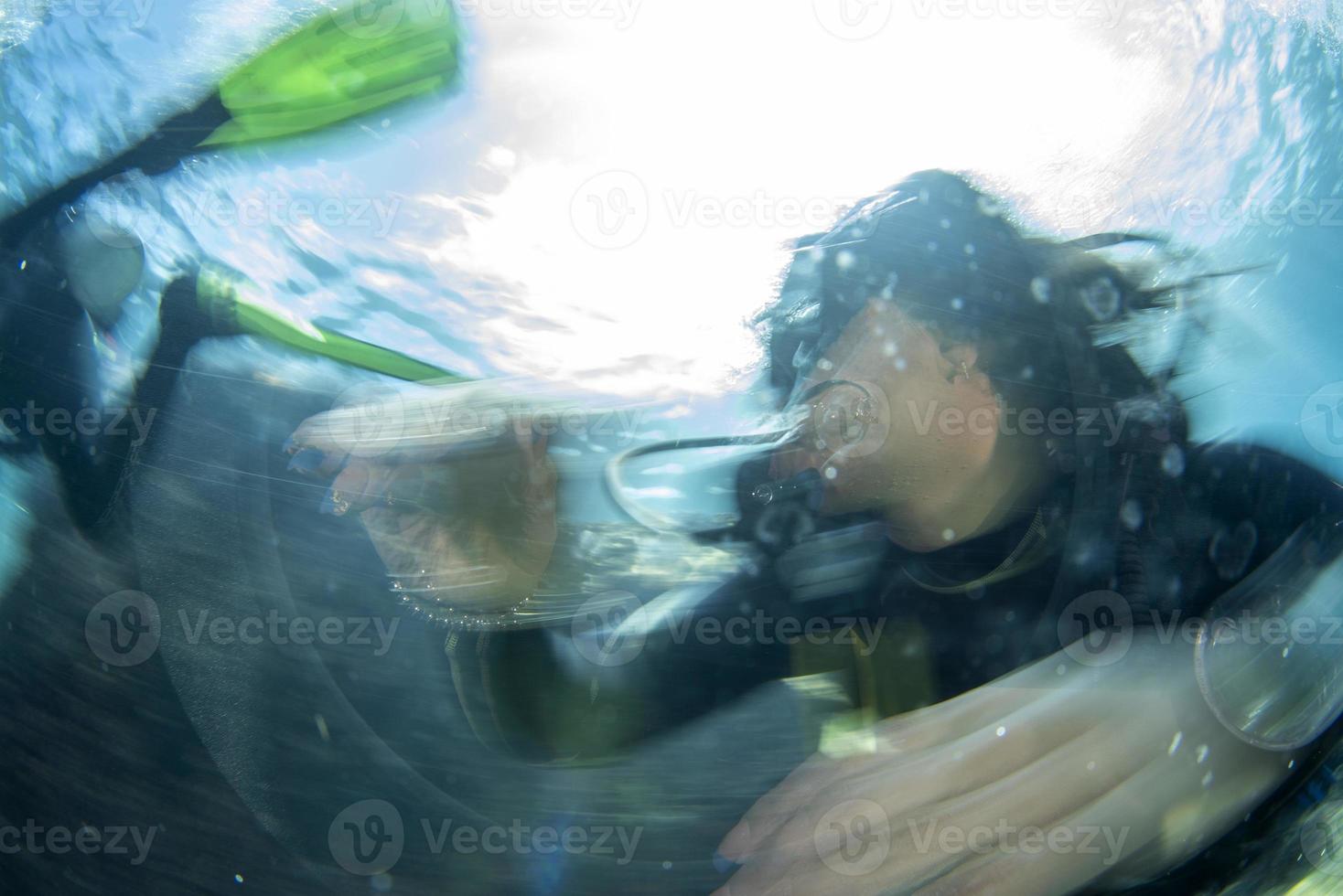 beautiful latina mexican girl diving in cortez sea photo