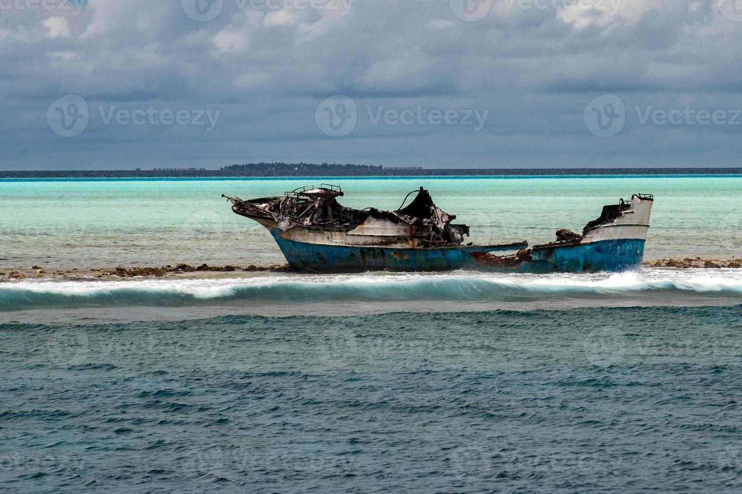 ship wreck on the reef photo