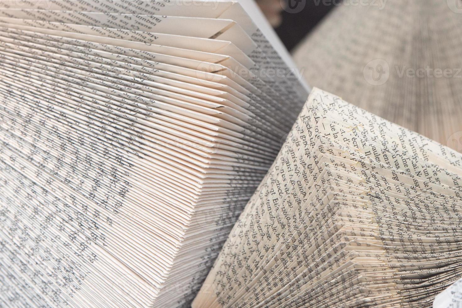 folded old book pages background photo