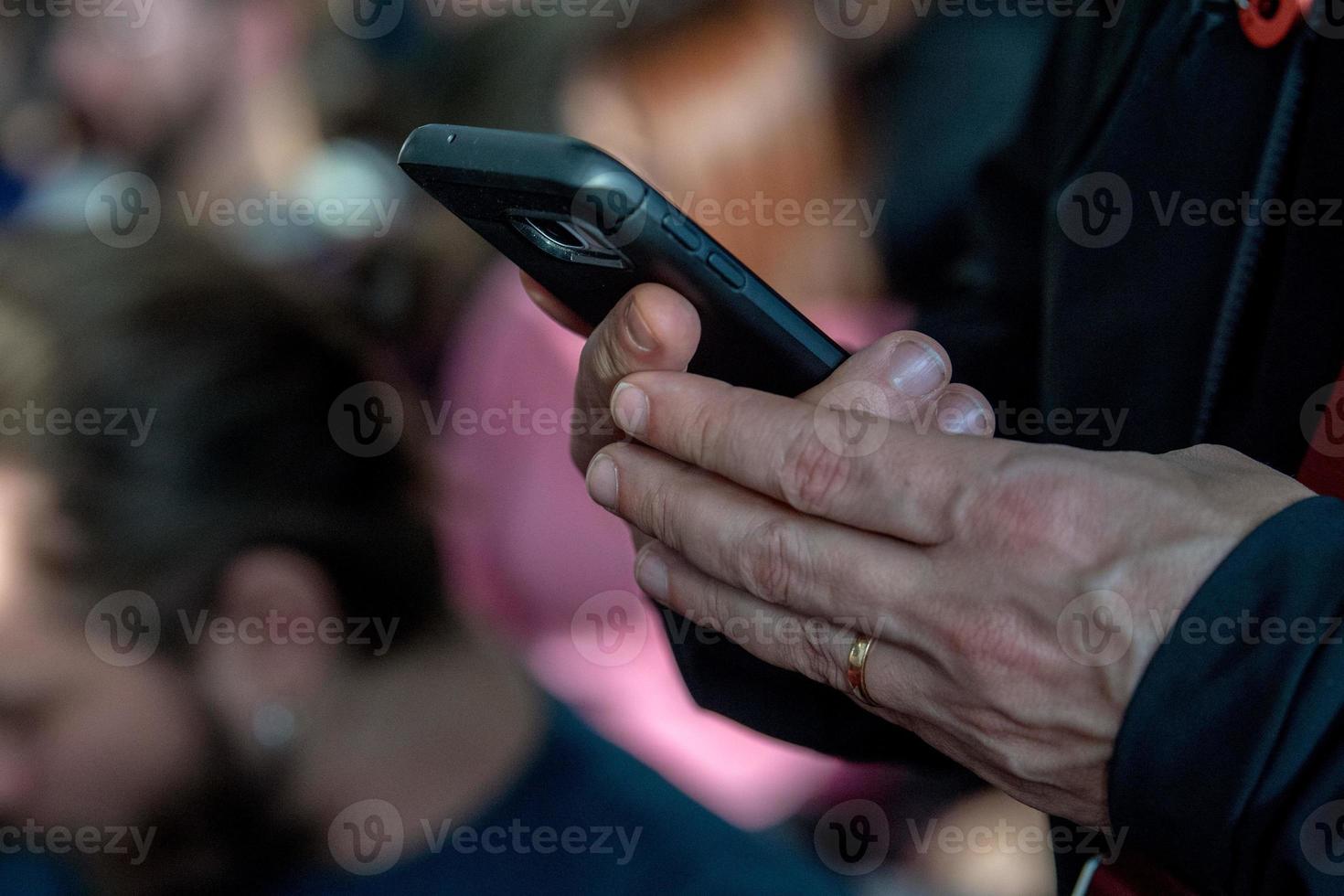 Hands while texting on cellular smartphone photo