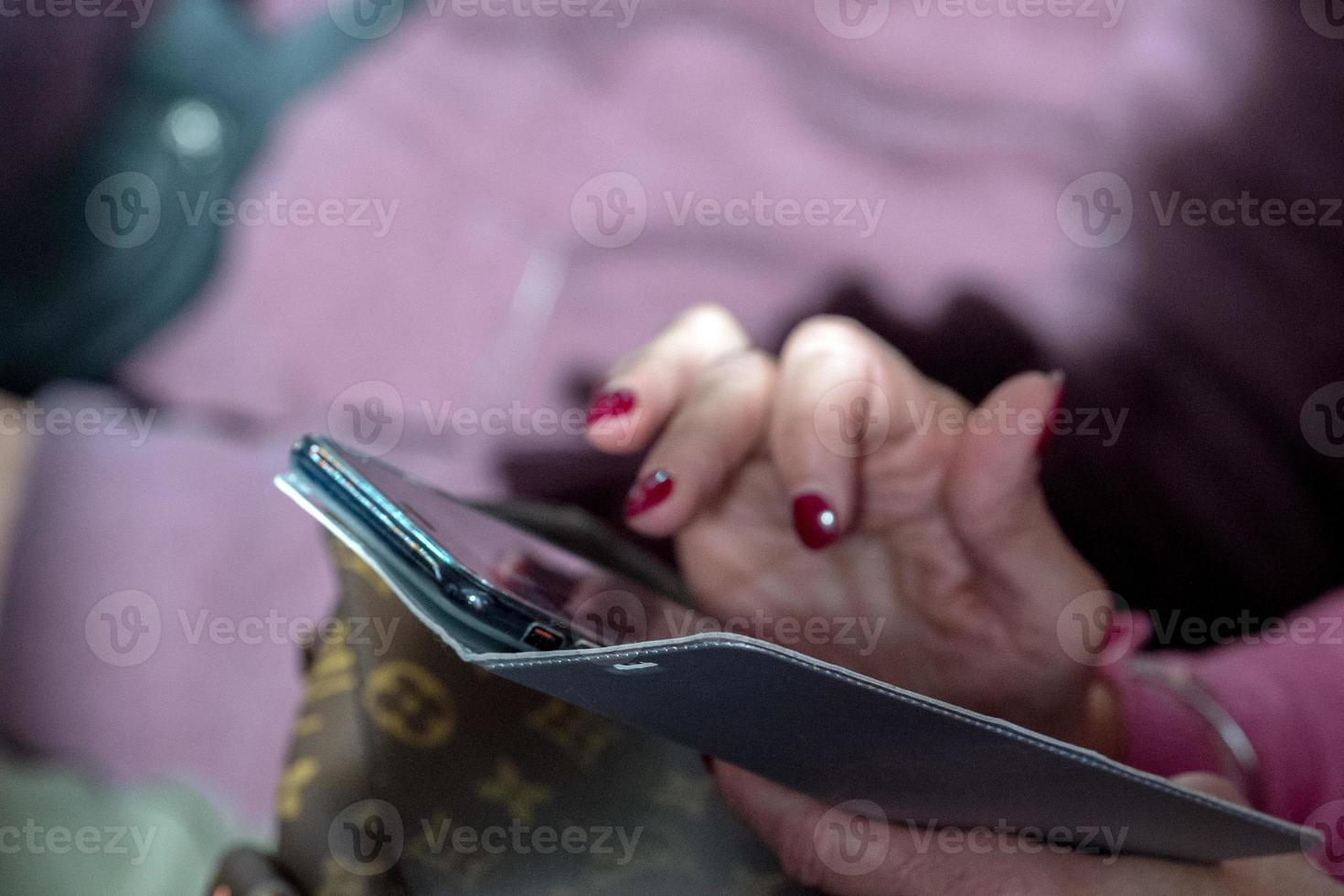 Hands while texting on cellular smartphone photo