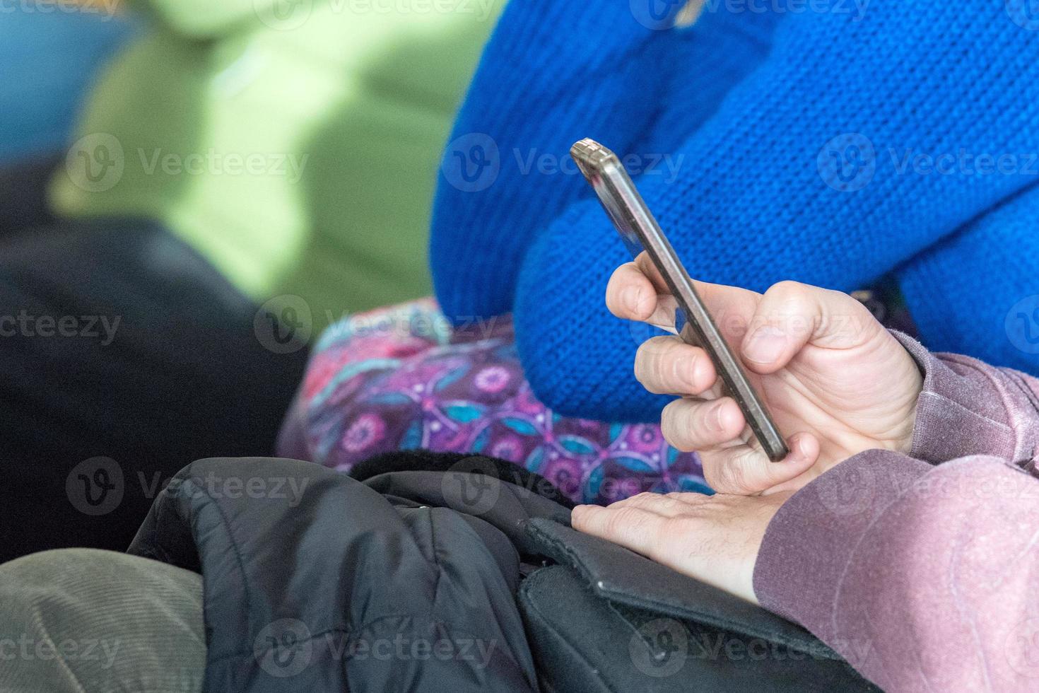 Hands while texting on cellular smartphone photo