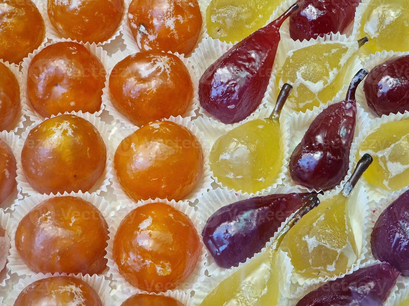 fresh glazed fruit sweet on display in pastry shop photo