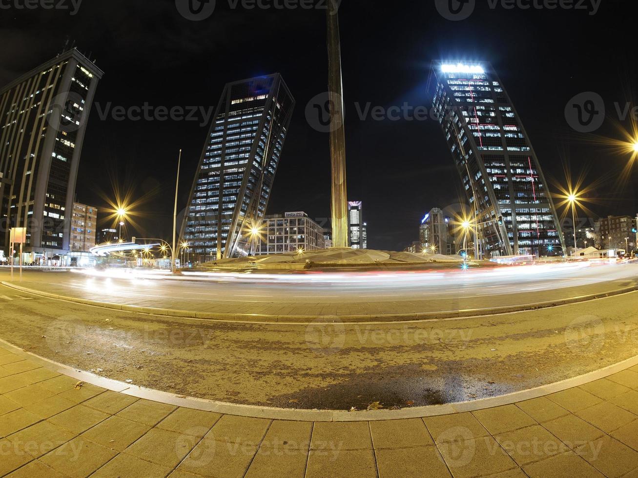 traffic jam in madrid castilla place at night with car lights tracks photo