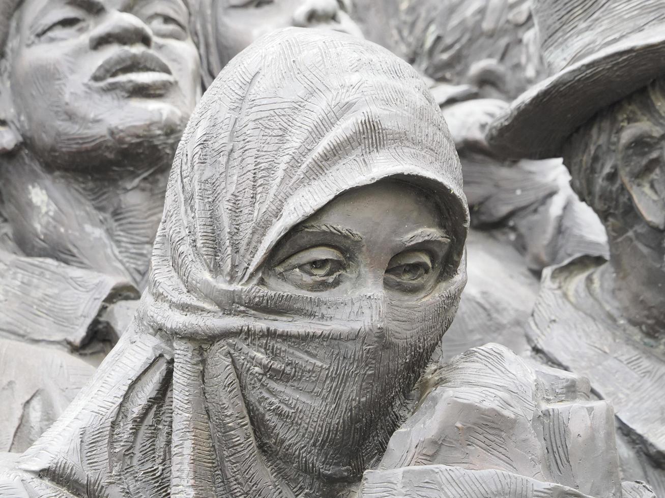 ROME, ITALY - NOVEMBER 25, 2022, migrants monument sculpture in Vatican place St. Peter's Square in Rome photo