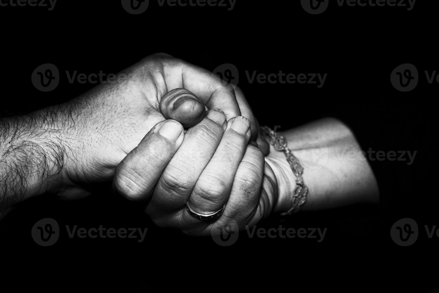 Lovers man and woman crossed hands photo
