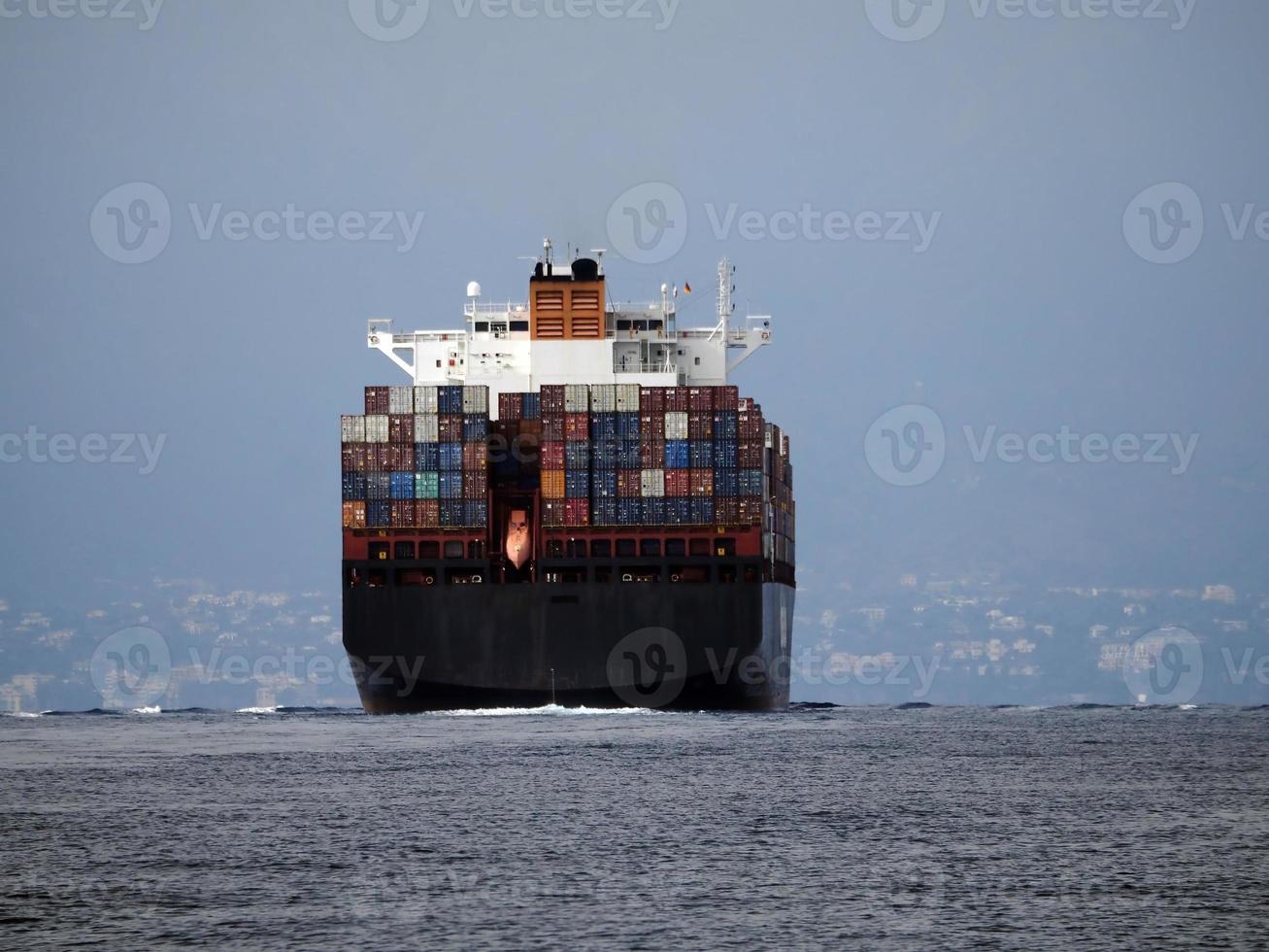 container ship in open sea photo