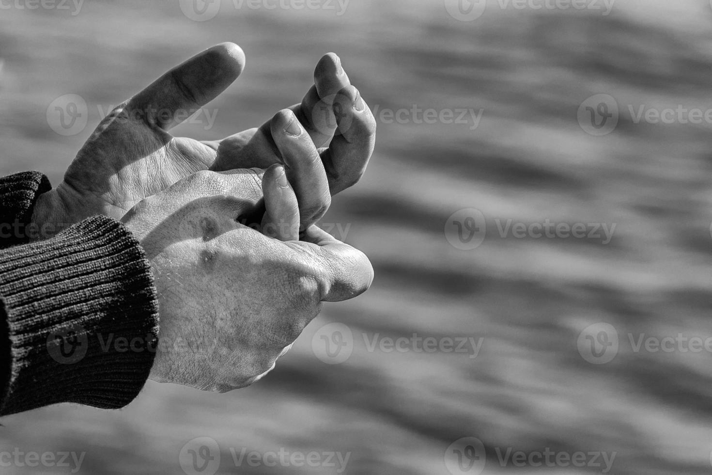 Sailor hands on blue sea background photo