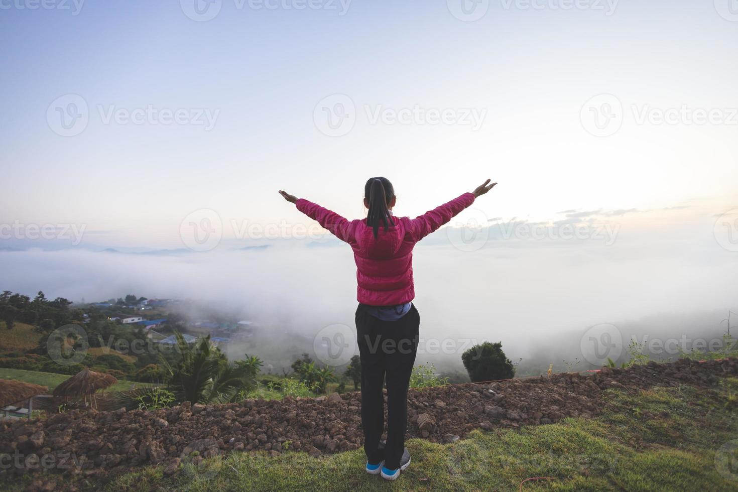 Woman praying in the morning on a cloudy background. Christianity concept. Pray background. Faith hope love concept. photo