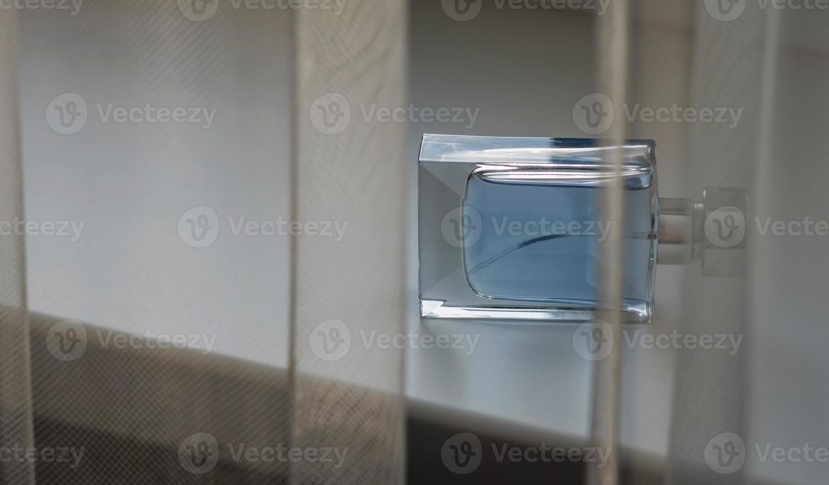 Transparent bottle of perfume photo
