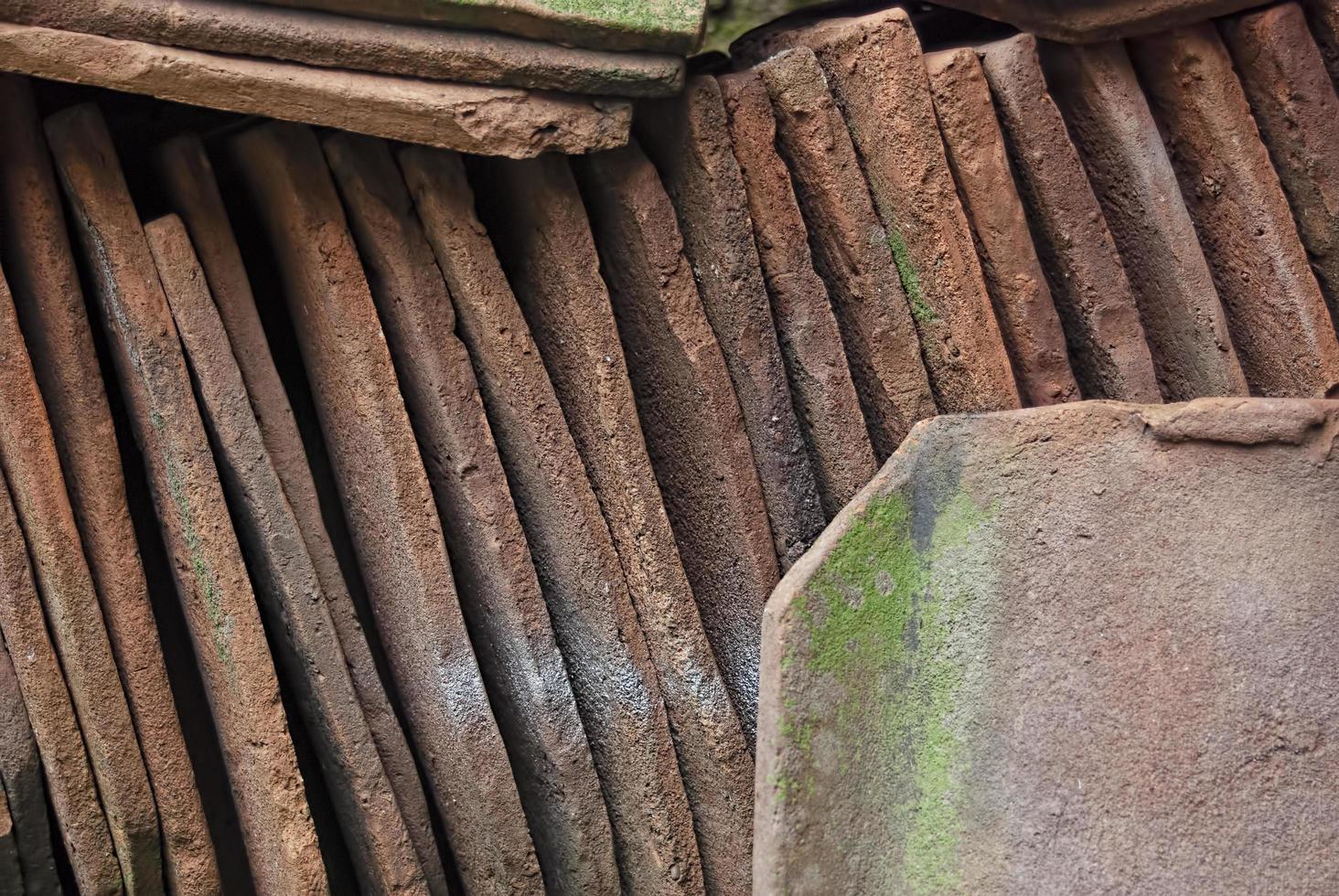 pile of old terracotta rooftiles, Close up. Textured summer background. photo