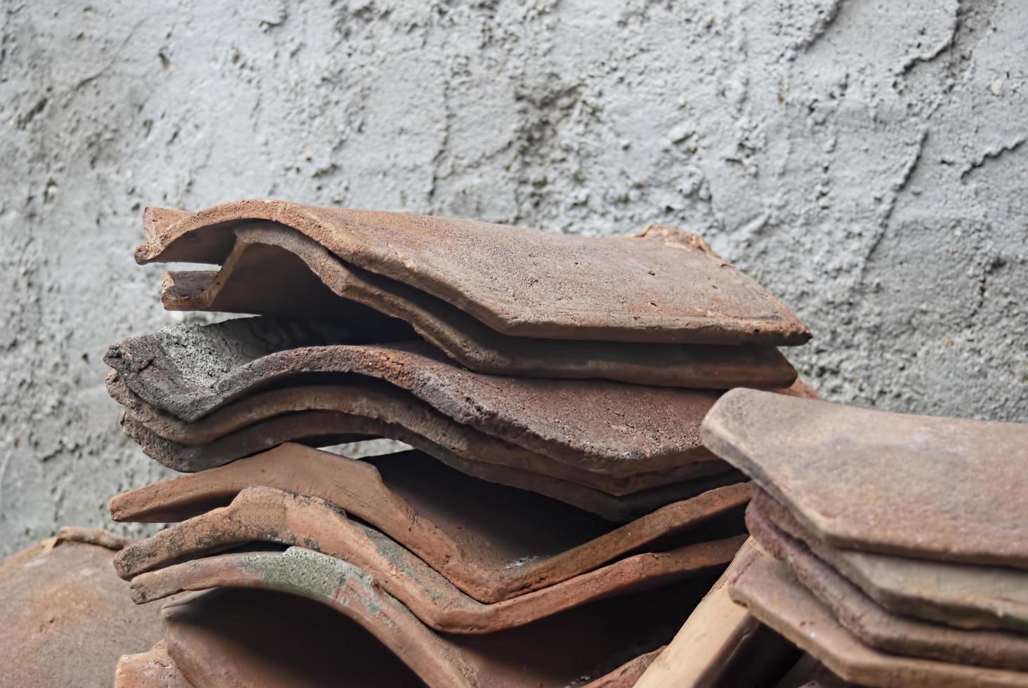 pile of old terracotta rooftiles, Close up. Textured summer background. photo