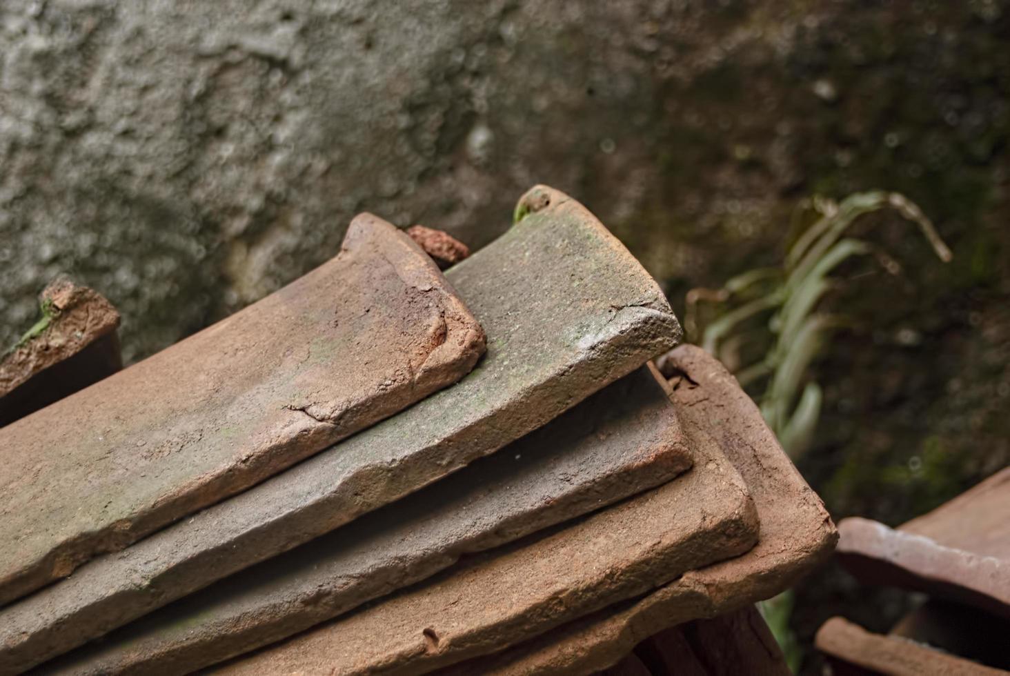 pile of old terracotta rooftiles, Close up. Textured summer background. photo