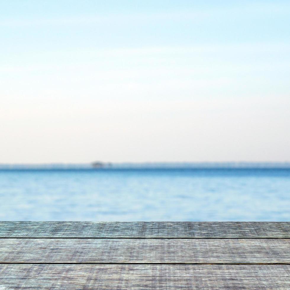 Old wooden table with blurred lake background  harbor product presentation background design template photo