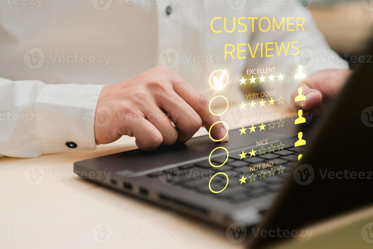 Man hand using computer laptop with popup five star icon for feedback review satisfaction service, testimonial. Customer service experience and business satisfaction survey. photo