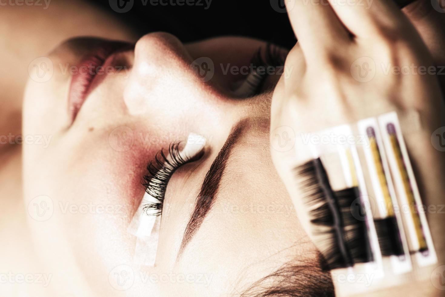 Eyelash Extension Procedure. Woman Eye with Long Eyelashes. Lashes, close up photo