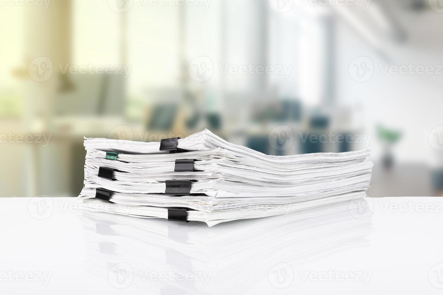 Stacks of papers on the desk in the office. business office photo