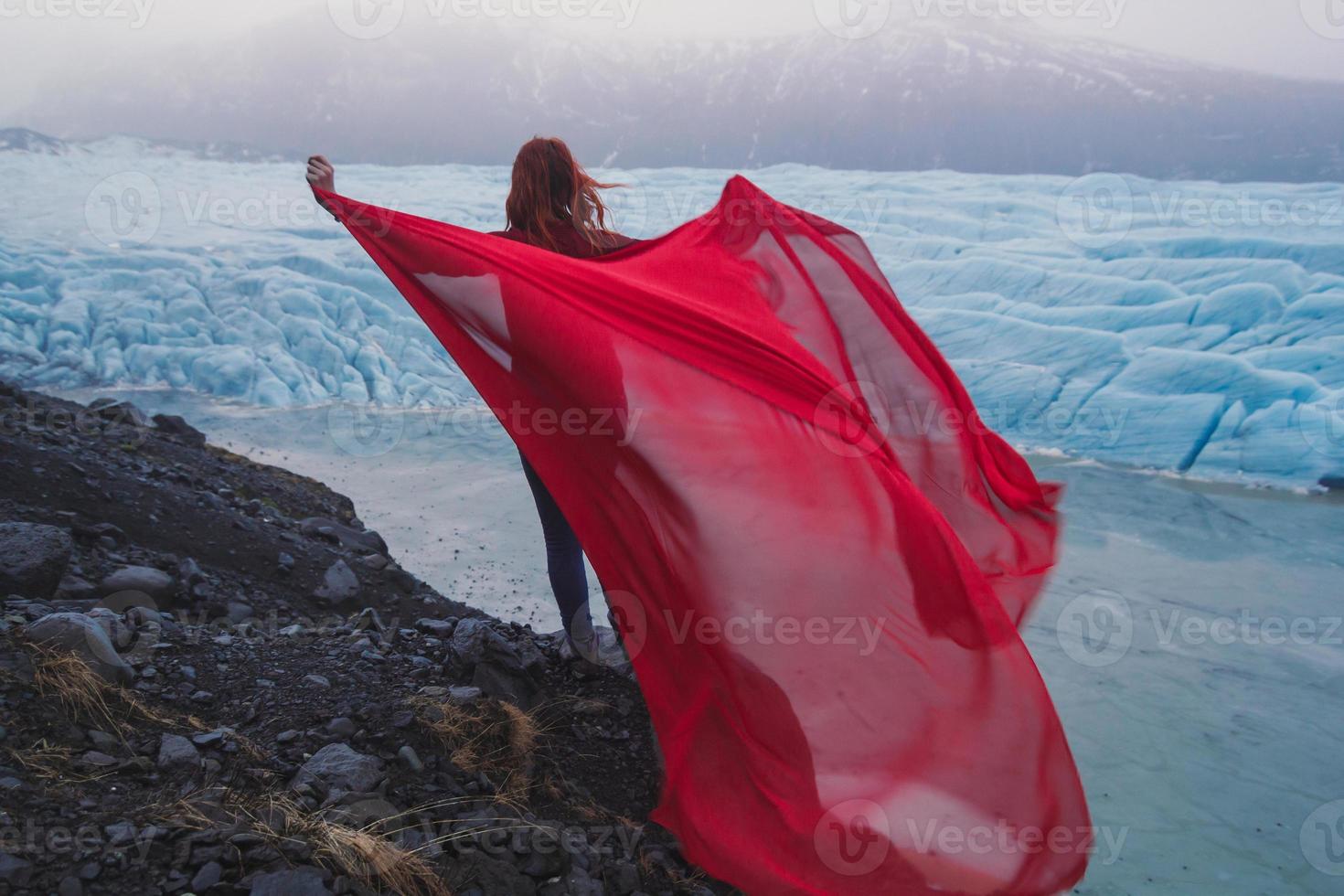 Person with sheet of waving chiffon scenic photography photo