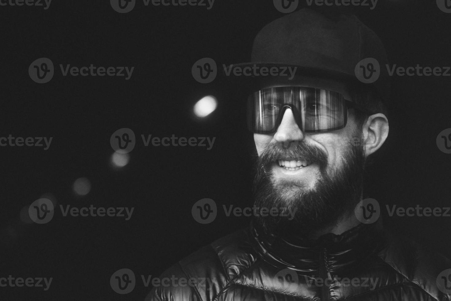 Young man with sports glasses in white and black photo