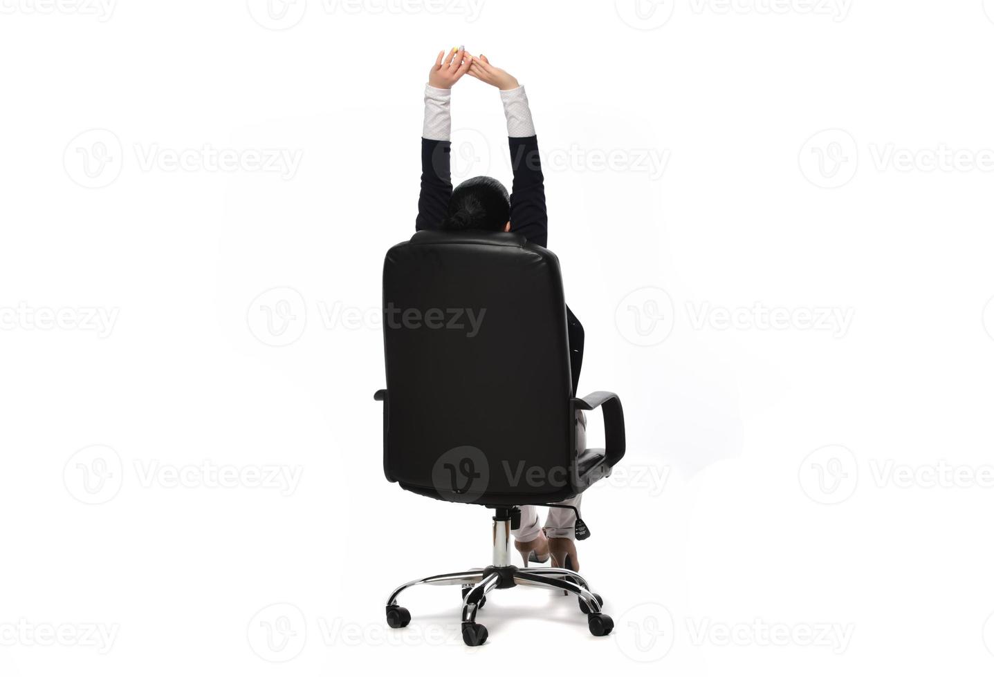 Young businesswoman sitting in comfortable office chair on white background photo