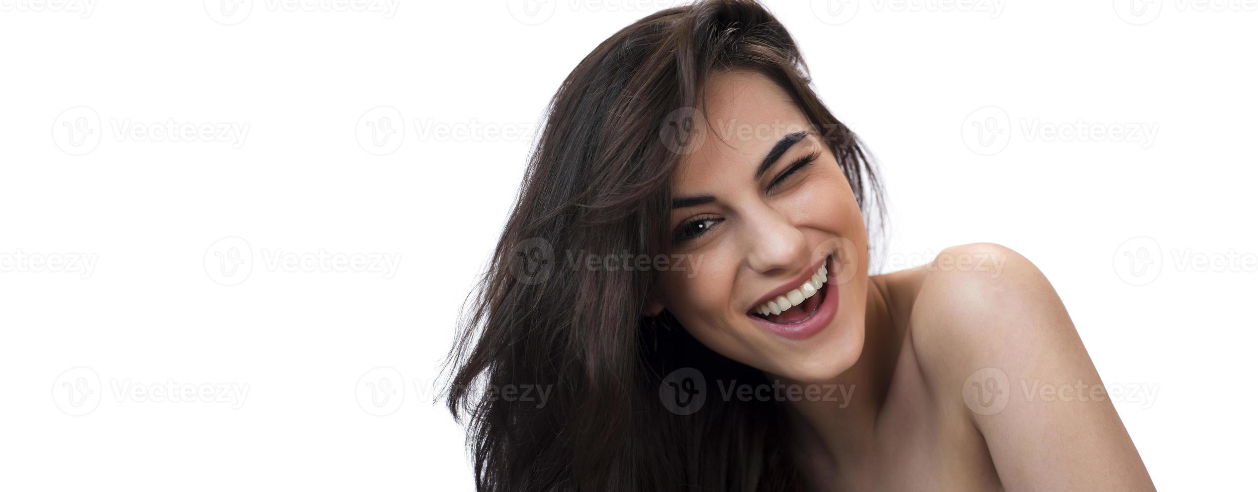 Portrait of attractive woman on white wall background photo