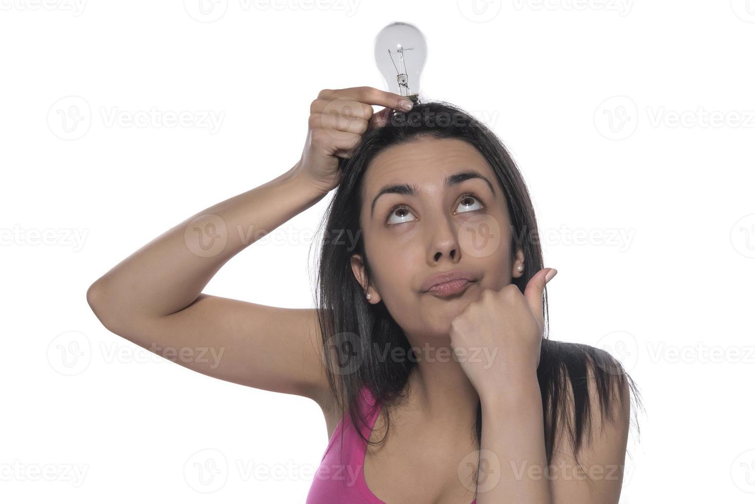 woman holding a light bulb. Innovation concept with technology, innovation and creativity, energy saving presentation concept. Young woman hand holding light bulb photo