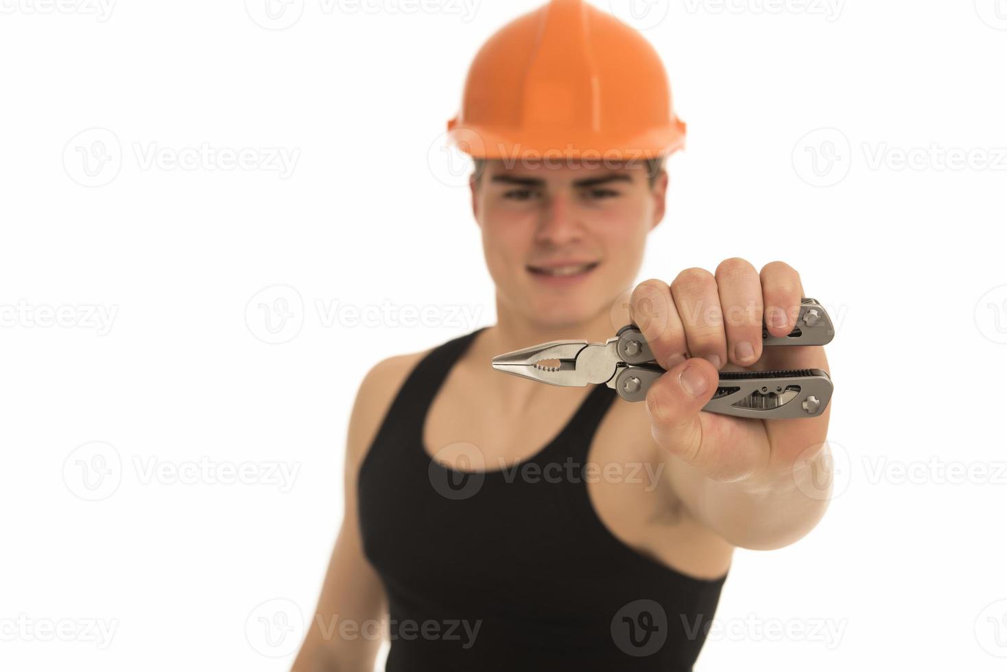 Portrait of happy young foreman with hard hat photo