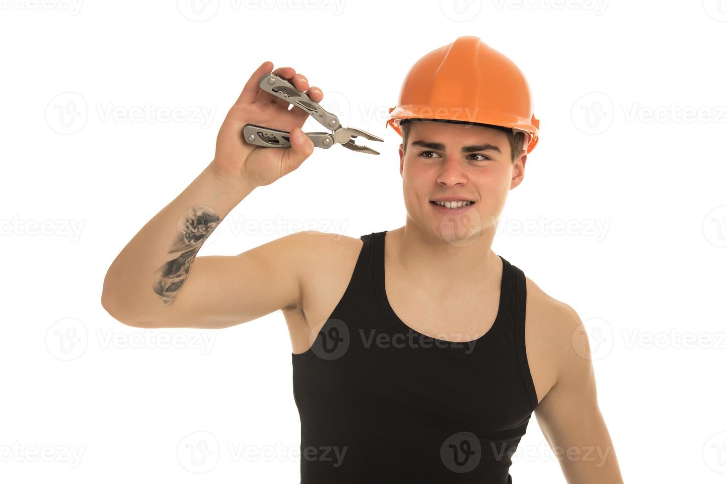 Portrait of happy young foreman with hard hat photo