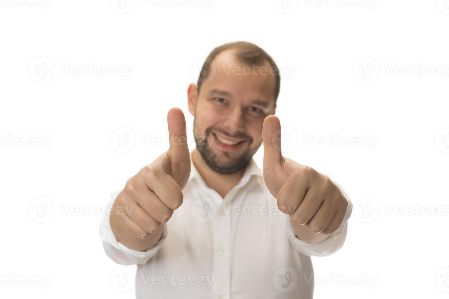 male hand showing thumbs up sign against white background photo