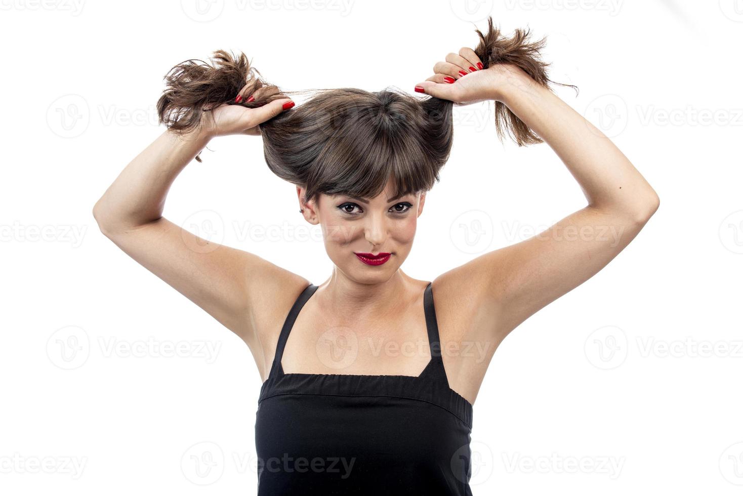 shot of young beautiful girl with hair bun photo