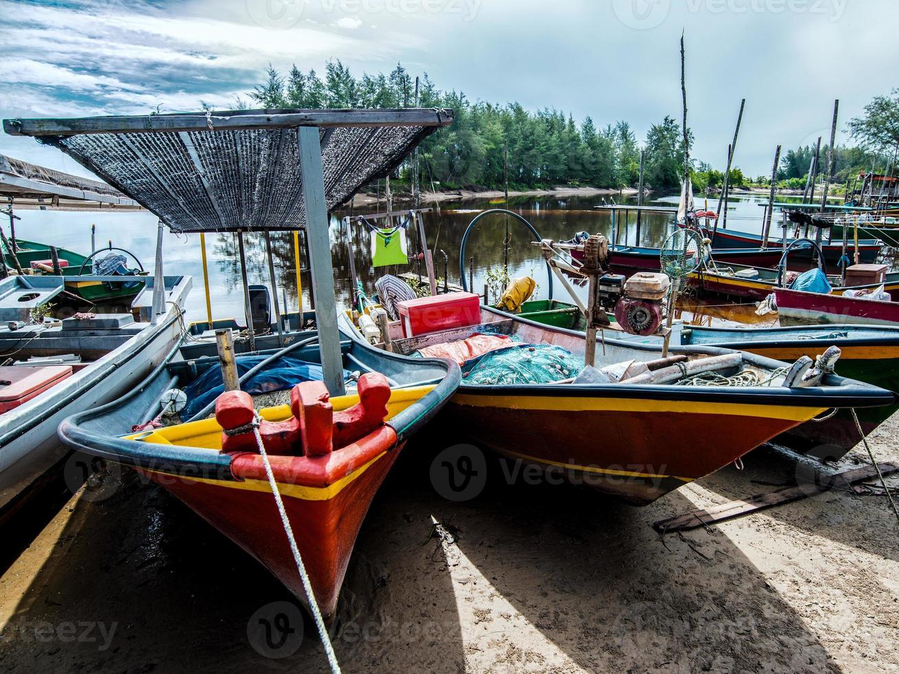 Colorful boats in the fishing village in Malaysia photo