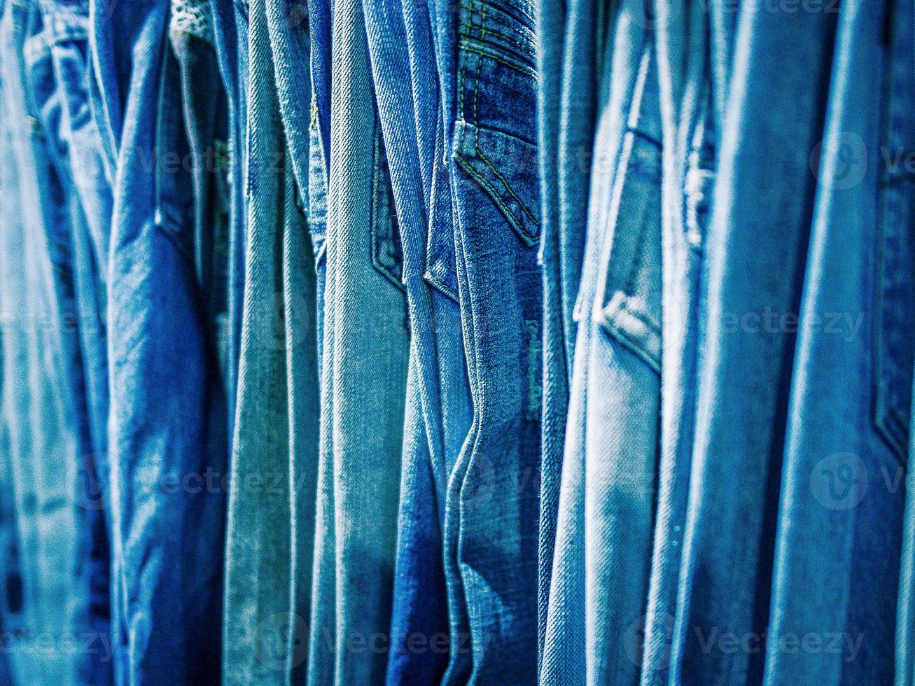 Close-up of blue jeans at a retail outlet photo