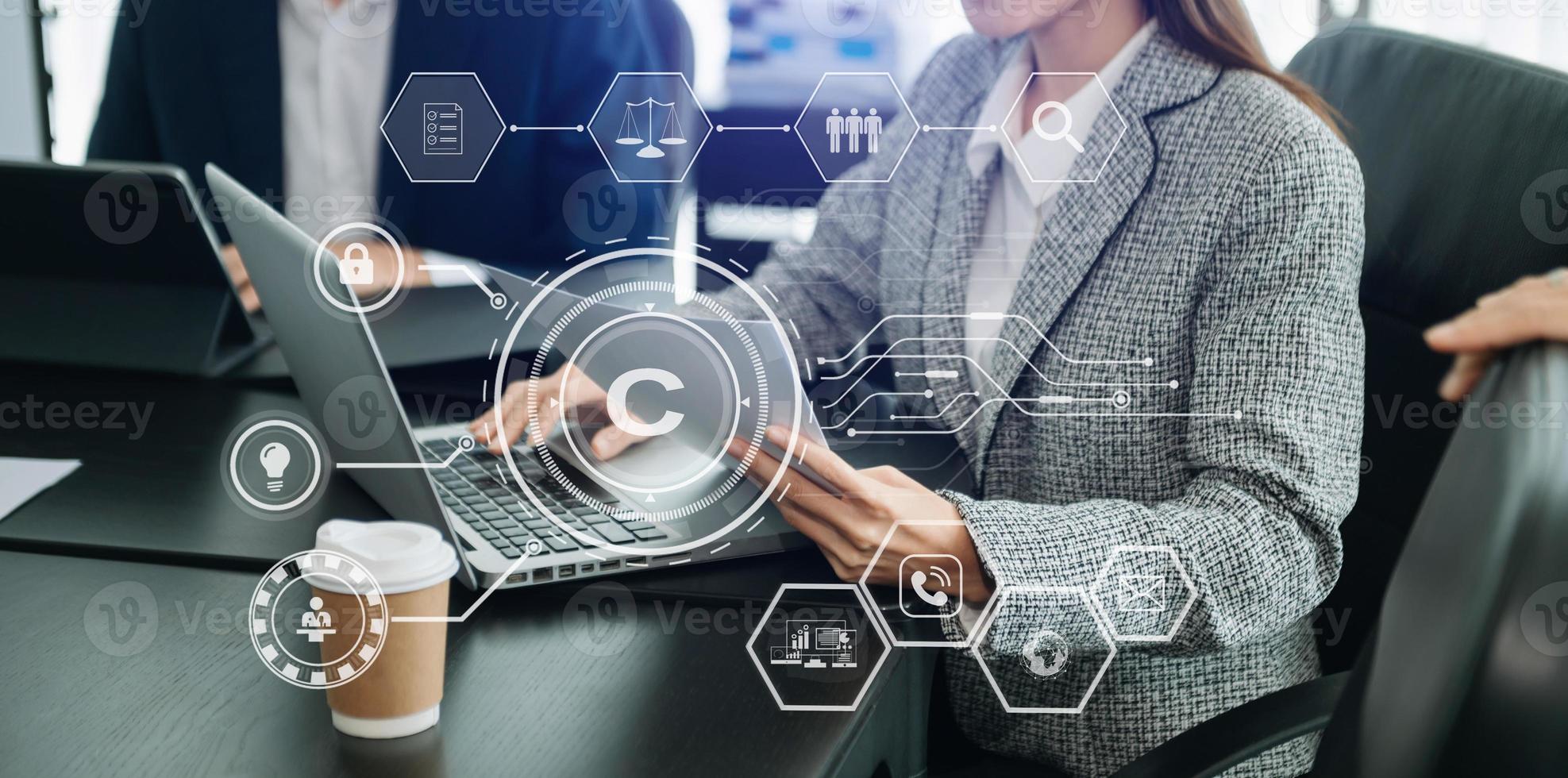 Copyright or patent concept, Business team analyzing data and using smart phone and tablet with virtual screen copyright icon trademark license, Creation ownership against piracy. photo