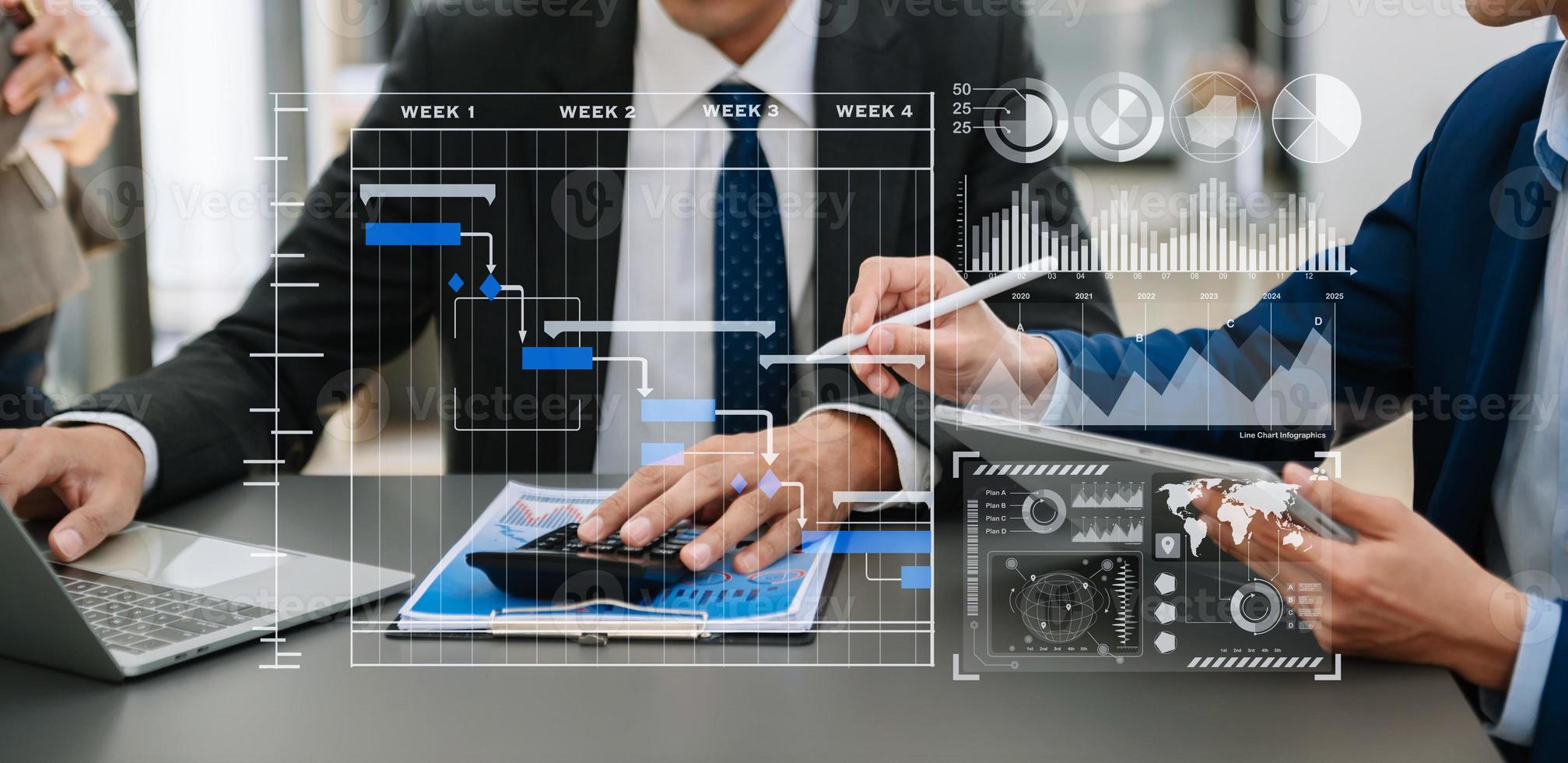 Businessman hand Project manager working and update tasks and Gantt chart scheduling virtual diagram.with smart phone, tablet and laptop in office. photo