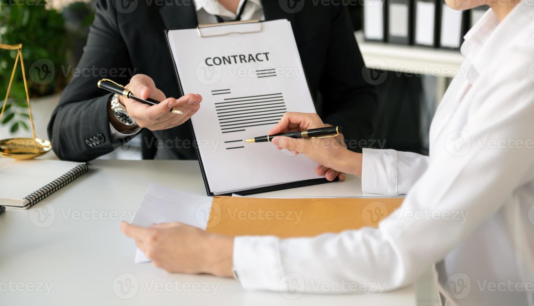 business people and lawyers discussing contract papers sitting at the table. Concepts of law, advice, legal services. in morning light photo