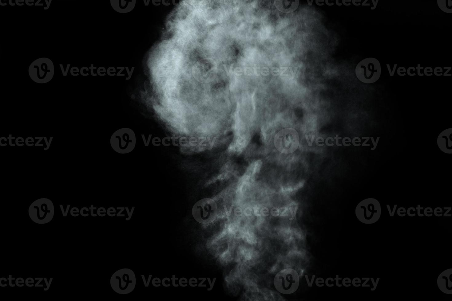 Abstract  powder or smoke isolated on black background photo