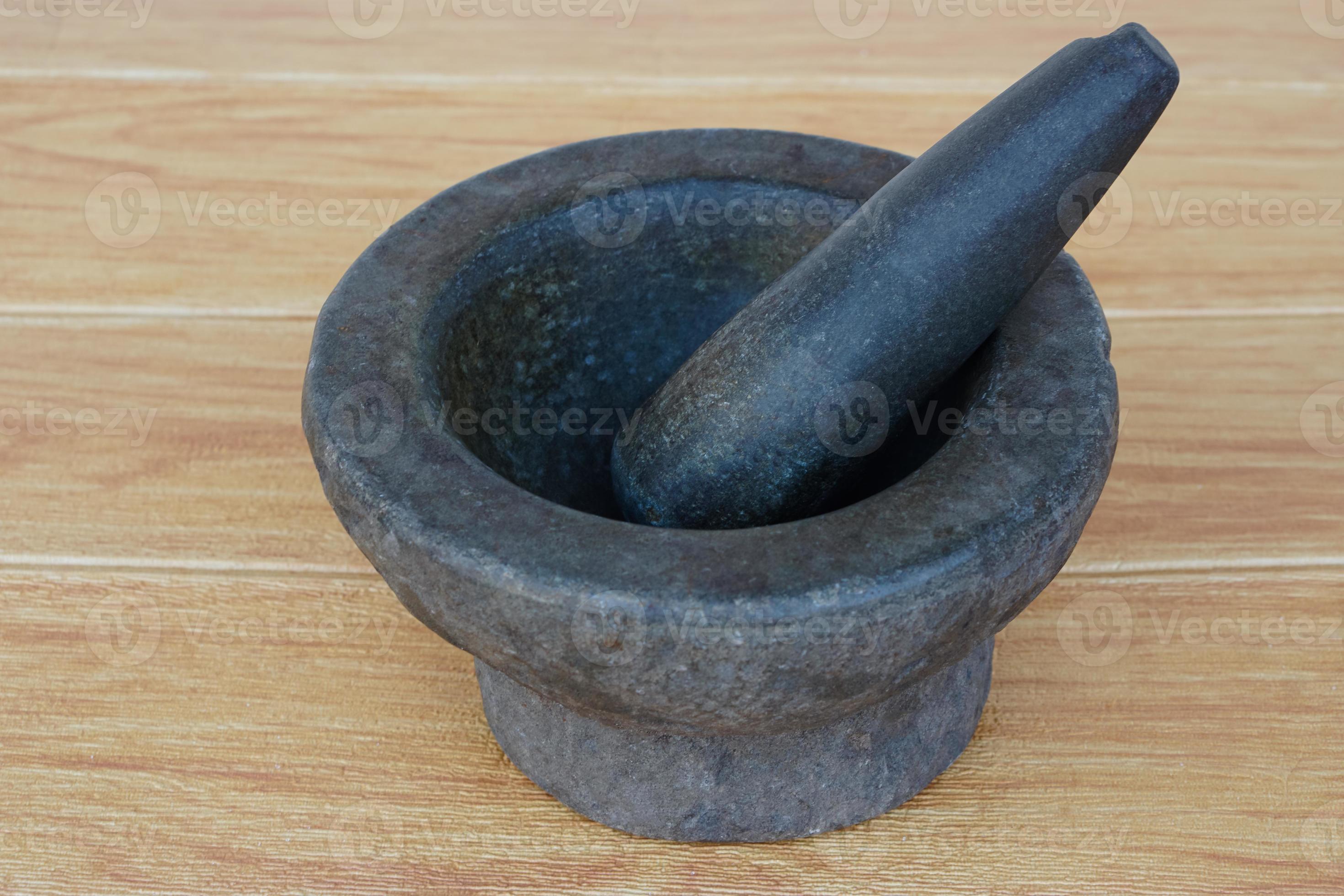 Old granite stone mortar and pestle. Concept, kitchen utensils .Thai