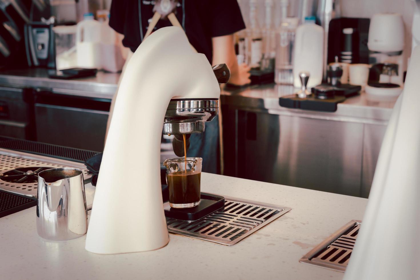 Barista making espresso with espresso coffee machine. photo