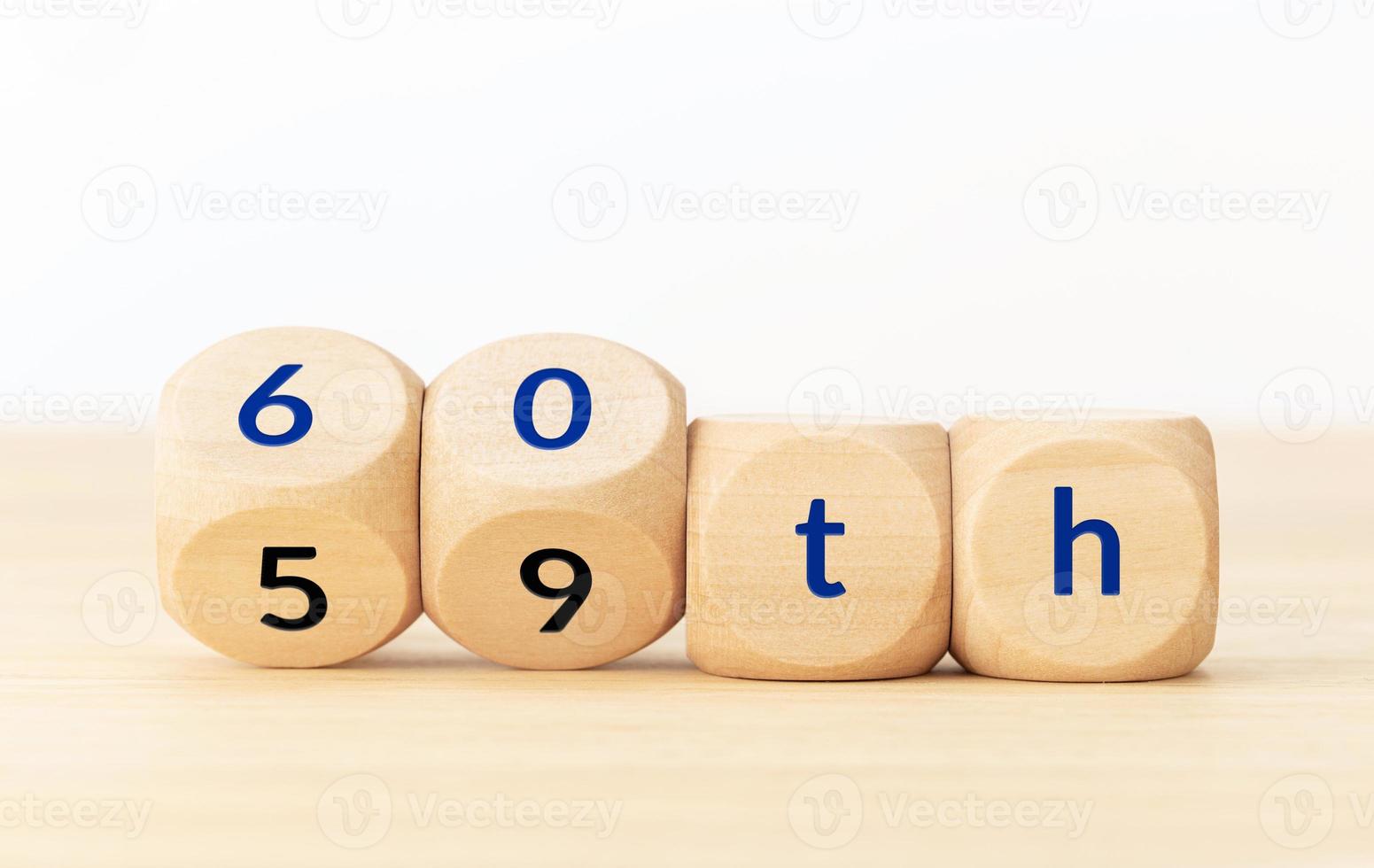 Turning 60 years old concept. Text on wooden blocks and changing dices. Copy space photo